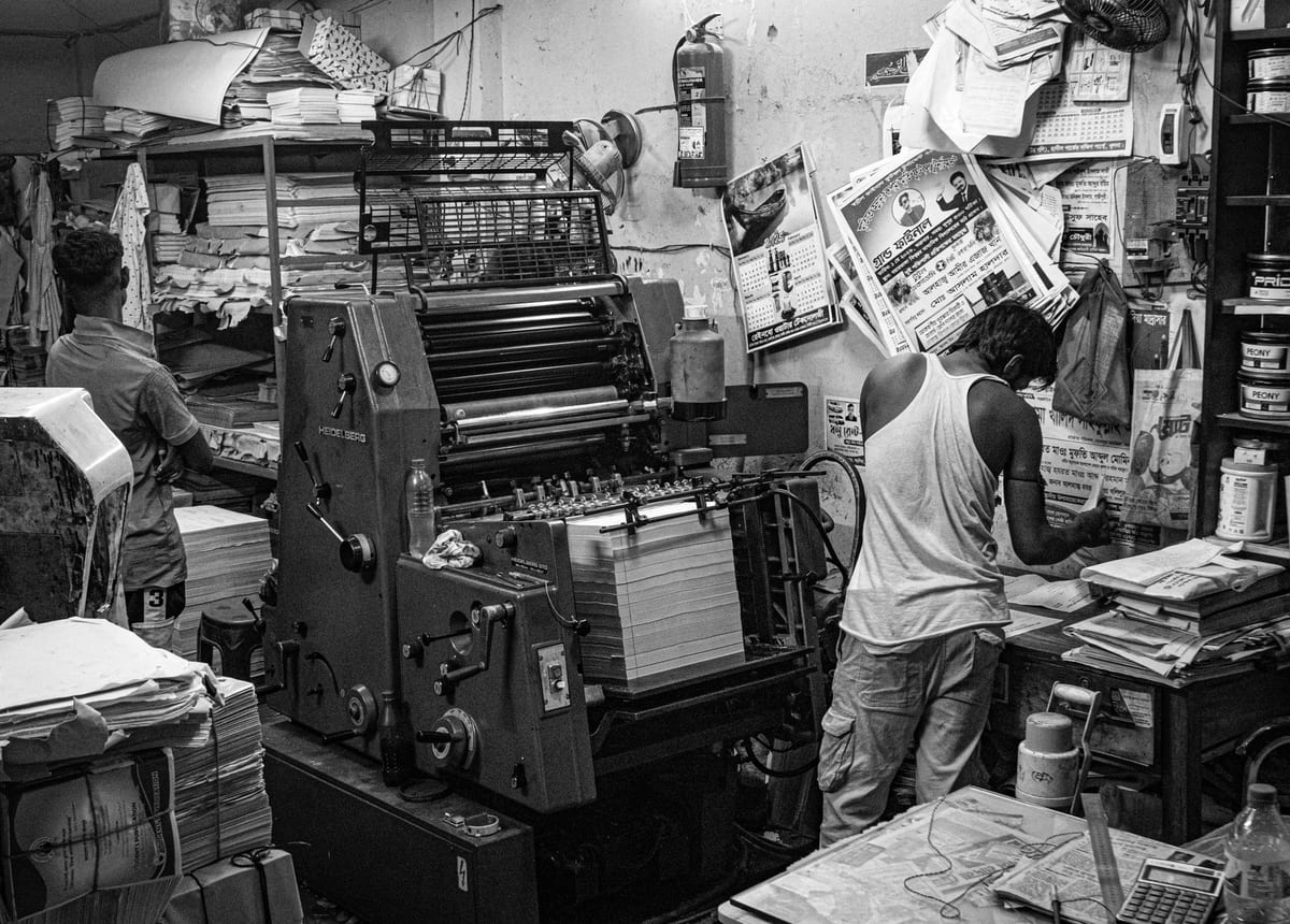 A busy print shop with presses running